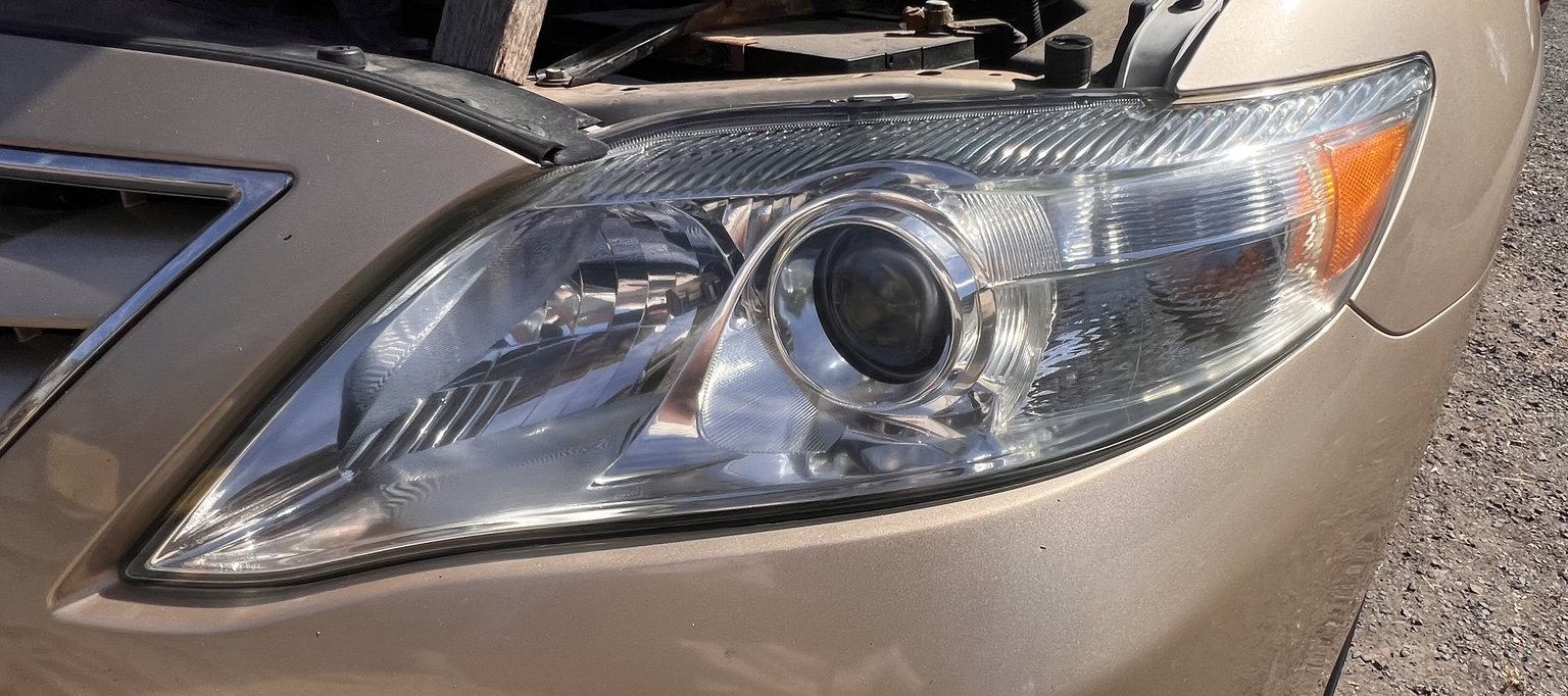 Close-up of restored Toyota Camry headlight after KBHR service
