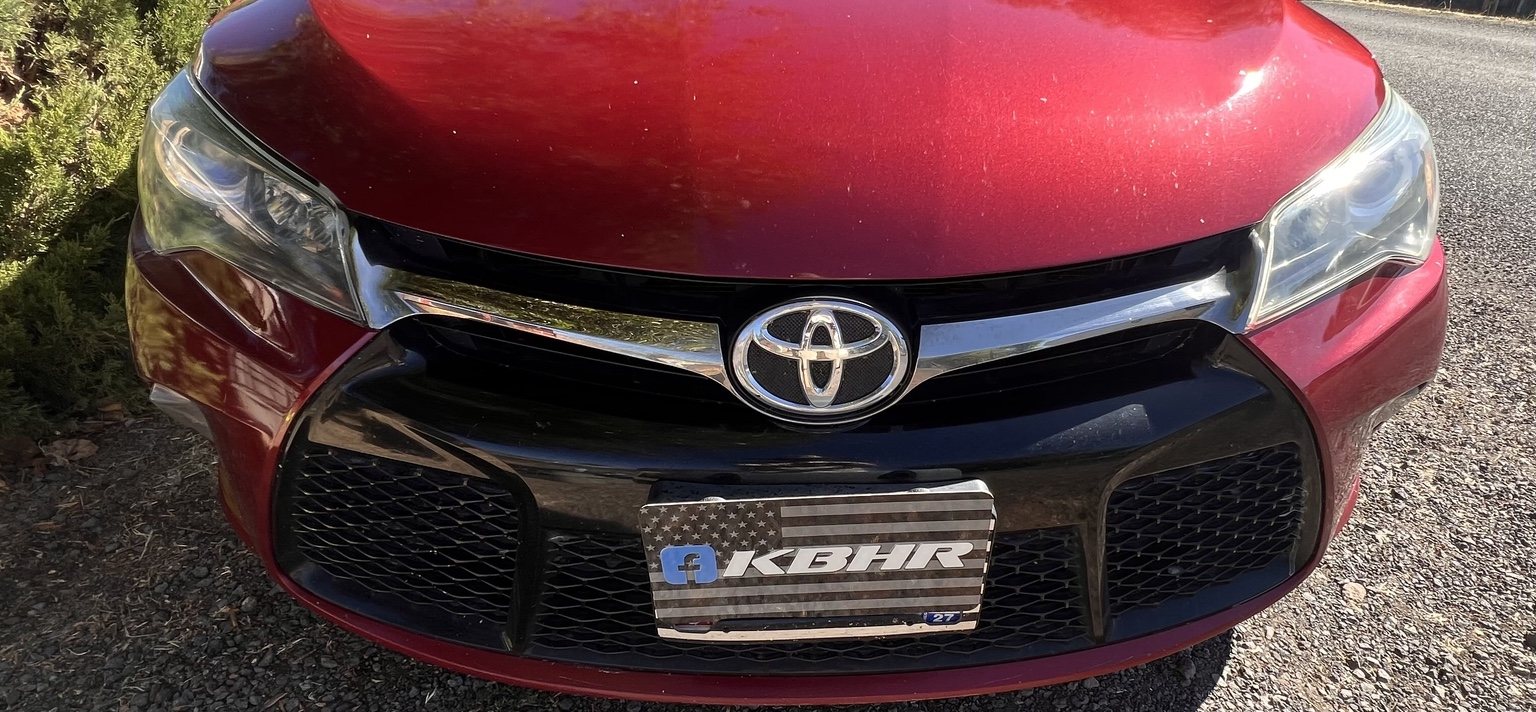 Red Toyota Camry with improved clear headlights after KBHR restoration in Klamath Falls Oregon