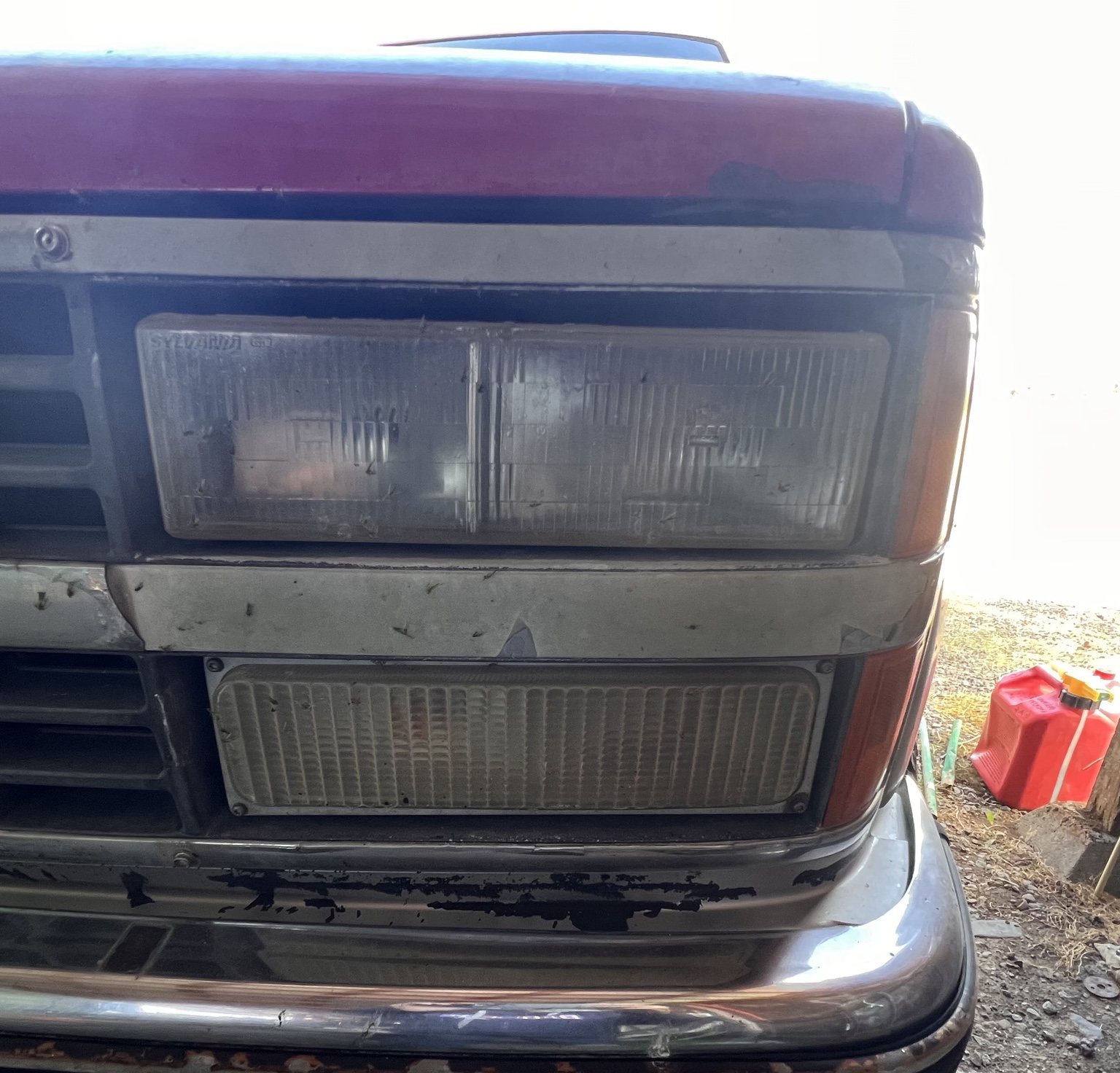 Classic Chevrolet truck headlight detail before restoration